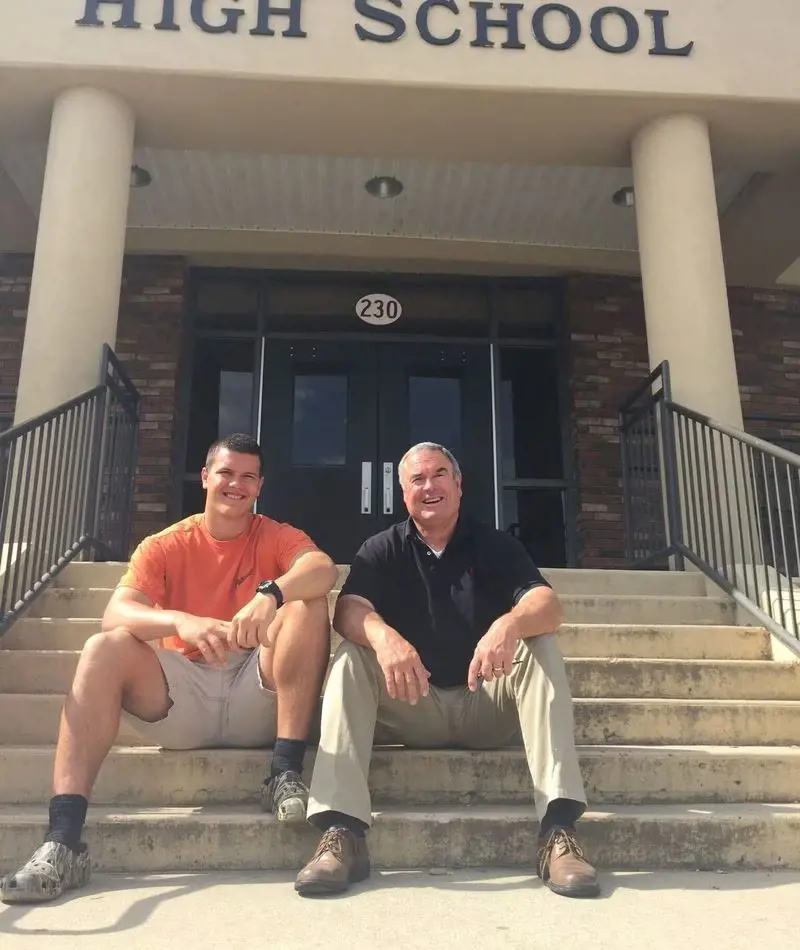 Charlie and his father Kent in front of Rabun County High.
