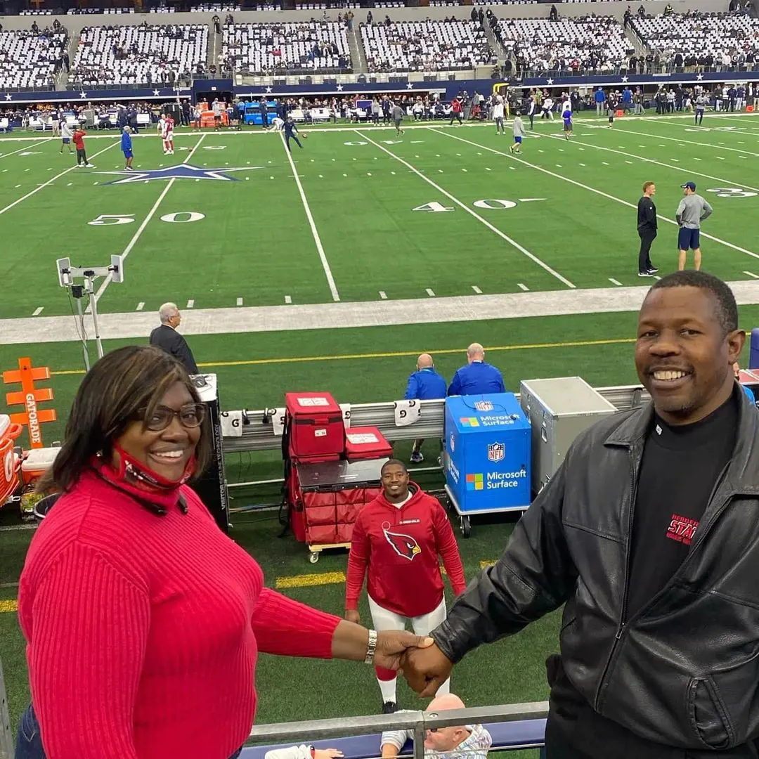 Kelvin Sr and Cutella attending Kelvin's game at the stadium. 
