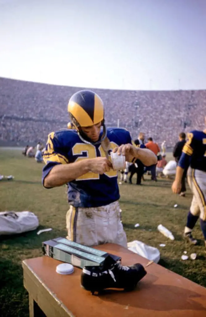 A player of the Rams using stickum during the game.