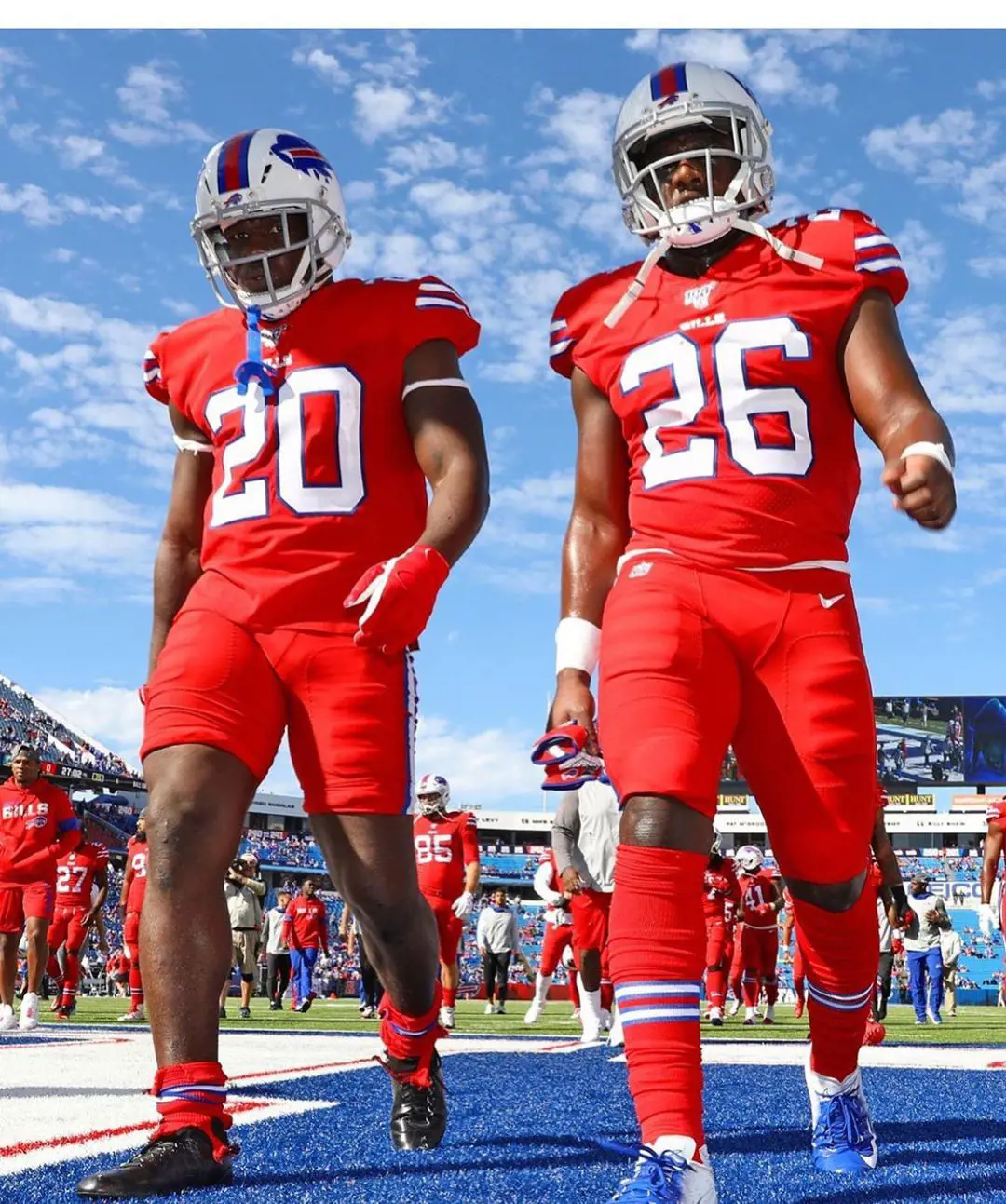 Frank is with Devin Singletary wearing their teams jersey