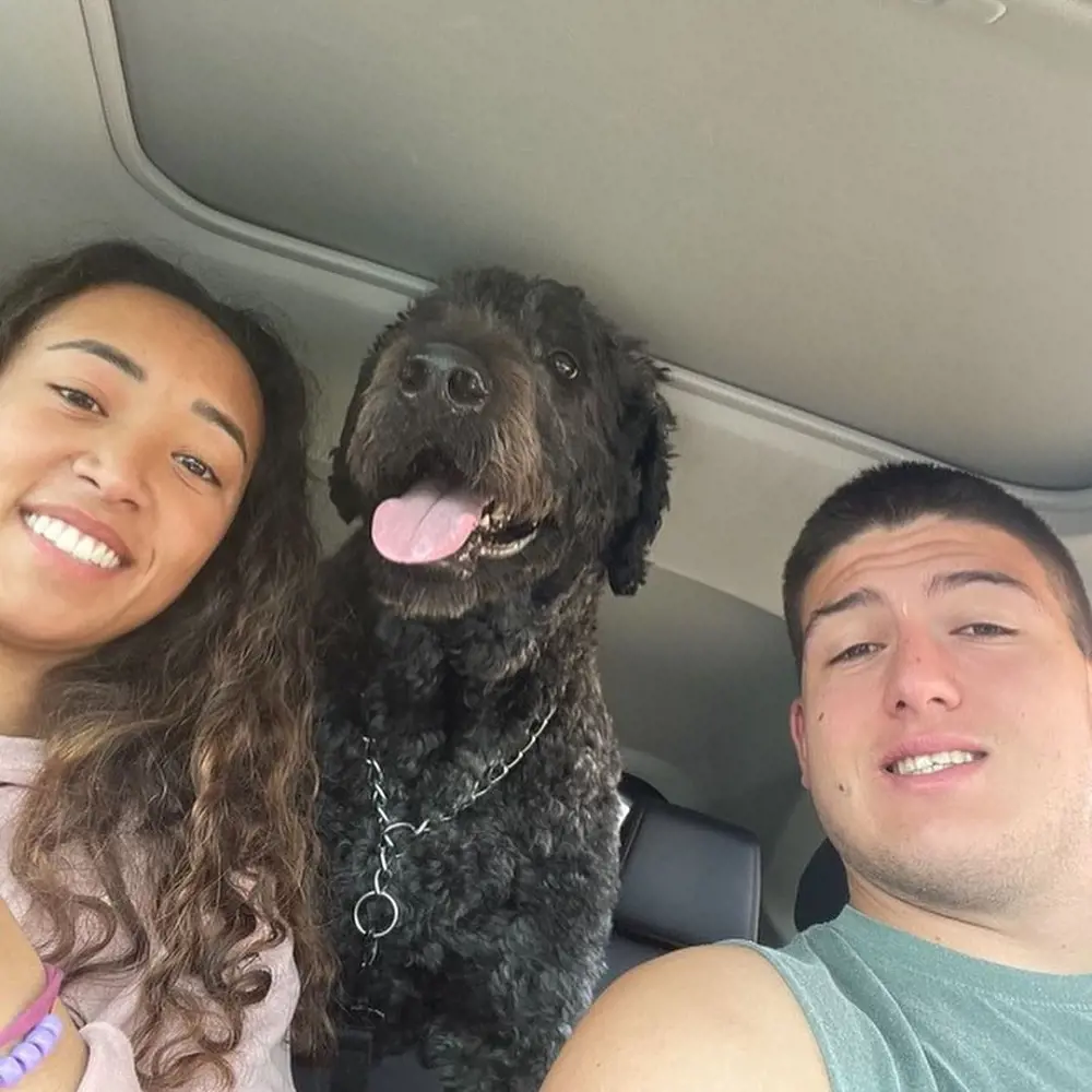 The 21-year-old football player with his partner Harris and pet dog (his BFF).