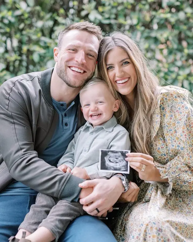 Taysom and Emily with their son Beau showing baby reveal image on November 2022.