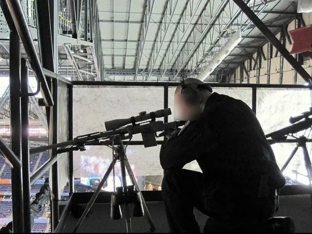 A miltary personnel placed over the field to safeguard people from any kind of security risk