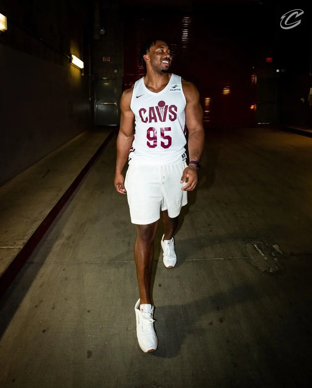 Myles flexing his football jersey number in a stylish way
