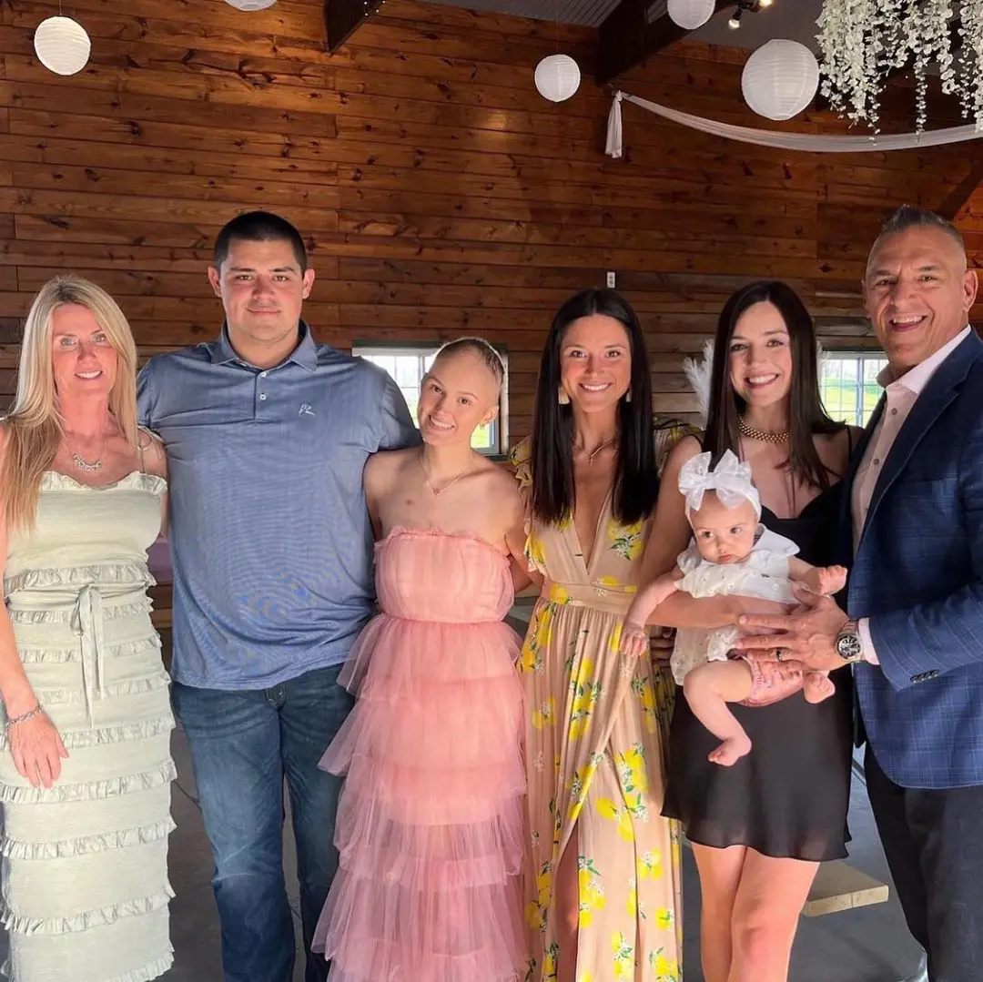 Bryan with his family together for childhood cancer awareness together in 2022.