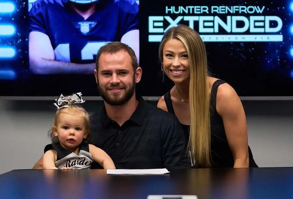 Hunter with his partner and daughter during his contract extension with the Las Vegas Raiders on June 10, 2022.