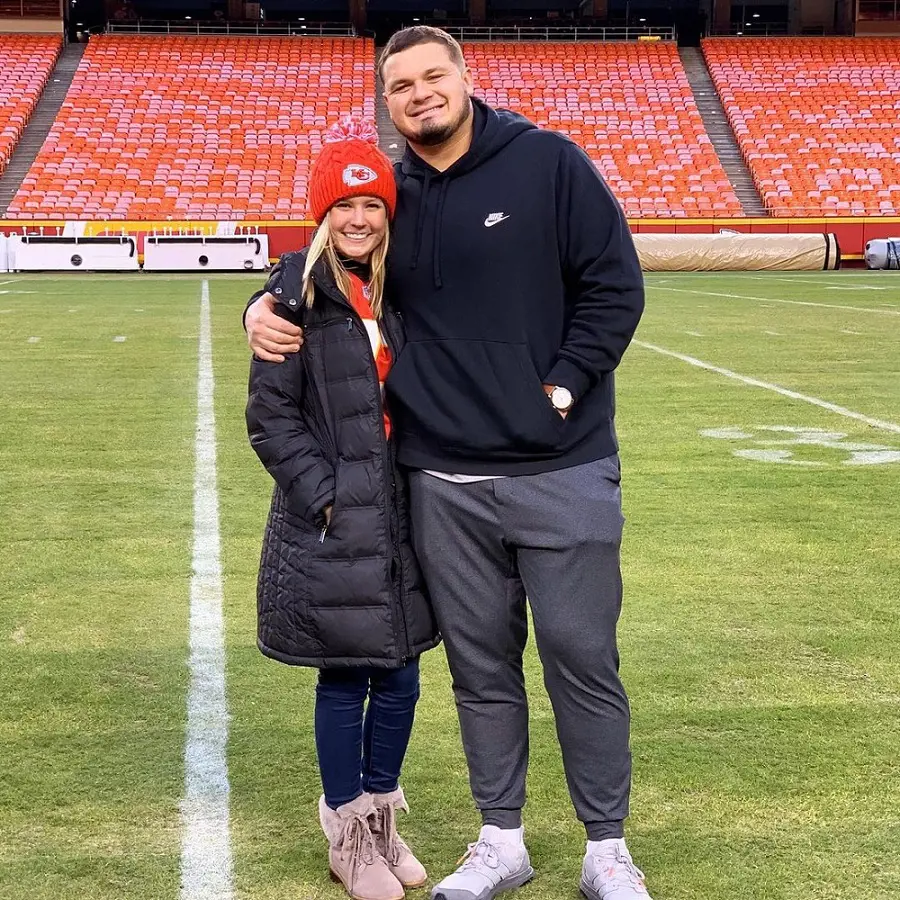 The 26-year-old football player with his partner at GEHA Field at Arrowhead Stadium in December 2019, celebrating a win during his rookie season.