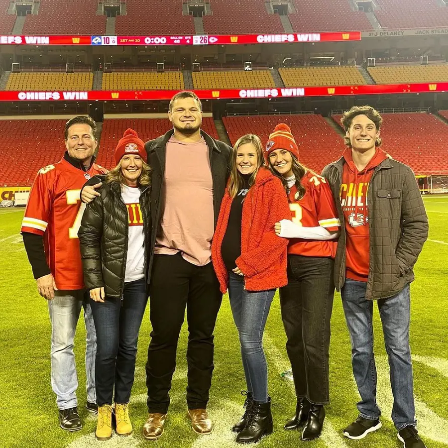 The newly-wed couple announcing their pregnancy with their family in November 2022.