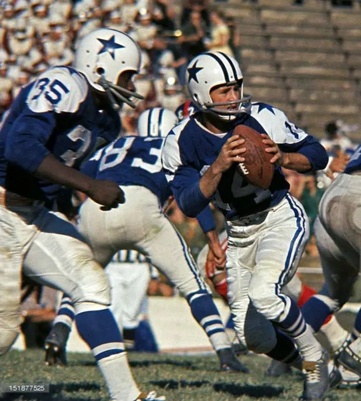 Edward playing football with Dallas Cowboys players